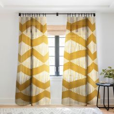 the curtains in this room are yellow and white