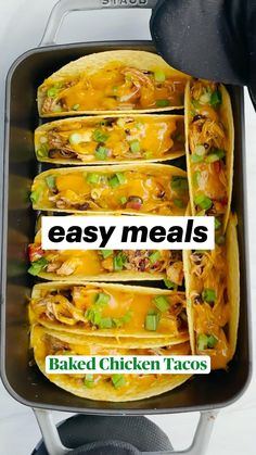 four tacos in a pan with the words baked chicken tacos