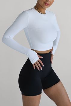 Made with premium Ultra-Soft Ribbed Fabric, this is one crop you won't want to take off! Our Ribbed Long Sleeve High Neck Crop Features: Premium Ultra-Soft Ribbed Fabric Nylon/Spandex Blend Thumb Holes Perfect for the gym, yoga, pilates, or styling up with your favourite outfits Minee wears a size XS Need help with sizing? Hit the "Message Us" button & we can help you find the perfect fit. White Workout Outfit, Fitness Outfits Gymwear, Sport Fits, Gym Sets, Outfit Sporty