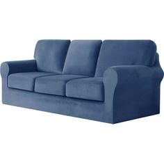 a blue couch sitting on top of a white floor