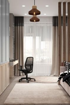 an office area with a chair, desk and window