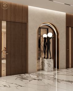 the entrance to an upscale hotel with marble floors and walls