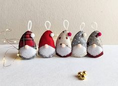 five christmas ornaments are lined up on a table