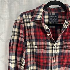 Red, Navy Blue, And Cream Flannel From American Eagle Is Like New, Never Worn. Featuring Chest Pockets, Button Down Front, And Buttoned Sleeves. 100% Cotton. Flannel Snap Button-up Tops, Red Long Sleeve Flannel Shirt With Buttons, Flannel Snap Button Shirt, Casual Plaid Flannel Shirt With Buttons, Collared Flannel Shirt With Buttons, Red Flannel Shirt With Buttons, Red Flannel Shirt With Button Closure, Red Collared Flannel Shirt With Buttons, Red Flannel Collared Shirt