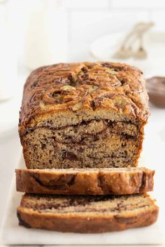 two slices of banana nut bread on a cutting board