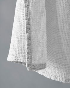 a white towel hanging from a hook