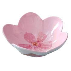 a pink flower shaped bowl on a white background