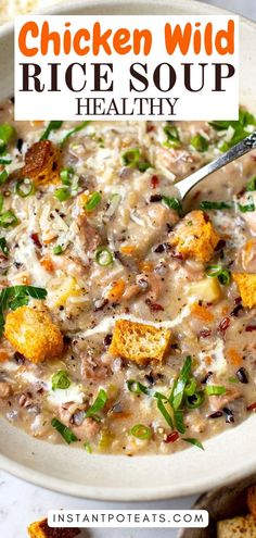 a bowl of chicken wild rice soup with croutons and parmesan bread