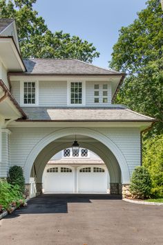 a large white house with an arched entrance