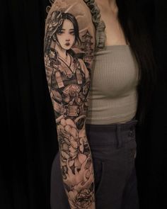 a woman with a tattoo on her arm