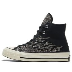 The Converse Chuck 70 High 'Archival Glitter Flame - Black Egret' is an exceptional shoe. Whether you’re a longtime collector or just looking to upgrade your style, this sneaker provides a bold edge that is sure to draw attention and pop out of any rotation. Combining archival glitter flame print with classic black egret elements, the silhouette seamlessly brings together nostalgia and modern chic. The canvas upper comes complete with tonal branding hints on the tongue, ankle patch, and medial s Sparkly Converse, Glitter Converse, Converse Design, Black Canvas Shoes, Custom Sneakers Diy, Converse Womens, Limited Edition Sneakers, Glitter Sneakers, Black Converse