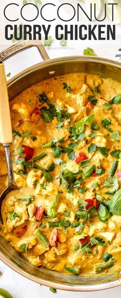 a large pan filled with curry chicken and garnish