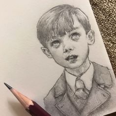 a pencil drawing of a young boy wearing a suit