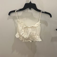 H & M Ruffled White Crop Top - Size Medium; Runs Small. Typically I Am A Small. Ties In Back To Allow For Strap Adjustments. Never Worn. Feminine Ruffled Crop Top For Vacation, Feminine Spring Crop Top With Ruffled Straps, Feminine Summer Crop Top With Ruffled Straps, Summer Crop Top With Ruffled Straps For Day Out, Feminine Ruffled Crop Top For Day Out, Feminine Ruffled Straps Crop Top For Spring, Summer Cotton Crop Top For Brunch, Summer Ruffled Straps Crop Top For Day Out, Fitted Summer Crop Top With Ruffles