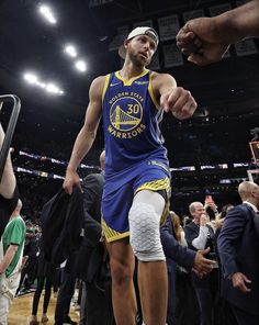 the golden state warriors'stephen curry walks off the court after his team won the game