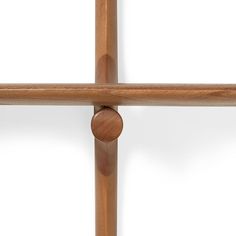 a close up of a wooden cross on a white background