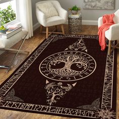 a living room area with a large rug on the floor and two chairs in front of it