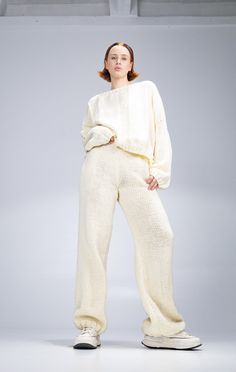 This unique handmade knitted loungewear set is a perfect blend of comfort, style, and exclusivity. Made from 100% natural yarn, the set is incredibly soft, breathable, and lightweight. With a relaxed fit, it's ideal for everyday wear or cozy lounging at home. Its neutral tone complements any wardrobe. Each piece is handcrafted and made to order, ensuring that you receive a one-of-a-kind outfit tailored just for you. The set includes wide-leg pants and a cozy sweater, making it an excellent choice for colder seasons, providing both warmth and a sense of luxury. Knitted Loungewear, Sweatsuit Set, Loungewear Set, Cozy Sweater, Sweater Making, Comfort Style, Handmade Knitting, Cozy Sweaters, Leg Pants