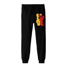 Introducing the boy's black Sesame Street jogger pants, a must-have addition to any young fan's wardrobe. These pants showcase a playful image of Elmo leaning against a vibrant stack of yellow letters, spelling out his iconic name. Crafted with a blend of 60% cotton and 40% polyester, these joggers offer a comfortable and durable fit, perfect for active play and everyday wear. The drawstring adjustable elastic waistband ensures a secure fit, while the machine washable fabric makes care a breeze. Yellow Letters, Black Jogger Pants, Active Play, Black Sesame, Black Joggers, Pajama Bottoms, Bottom Clothes, Sesame Street, Toddler Outfits