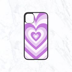 a purple and white heart phone case on a marble background with the words love is in the air