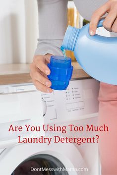 a woman is pouring water into a laundry detergent in front of a washing machine