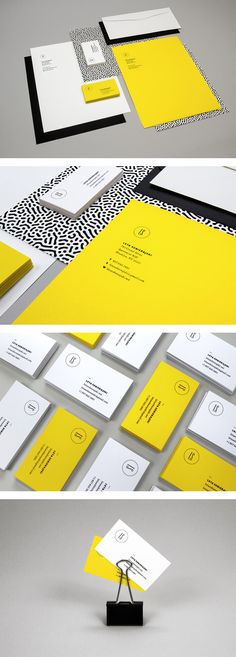 some yellow and white business cards with black accents on the front, back and sides