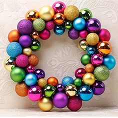 a colorful christmas ornament wreath with ornaments