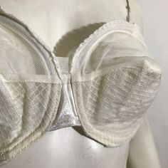 1950s white sheer circle cup bullet bra with overbust and underbust wire by Charmode. Lace trim, double straps in back with hooks- 28-33" around, 8" across inside of cup. Missing shoulder straps. Classic Full Cup Bra With Removable Cups, White Underwire Corset With Removable Bra Pads, Fitted Underbust Bra, Wedding Underbust Fitted Bra, White Underwire Corset With Fitted Bodice, White Fitted Bodice Corset With Underwire, White Corset With Fitted Bodice, Fitted Underbust Bra With Removable Cups, Classic Cream Bra With Padded Cups