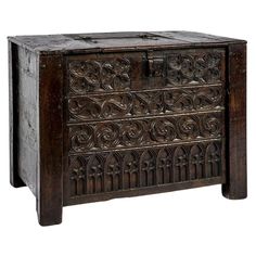 an old wooden chest with carvings on it