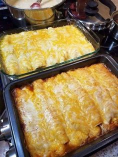 two pans filled with food sitting on top of a stove