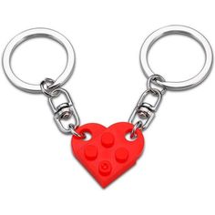 a red heart shaped key chain with two holes