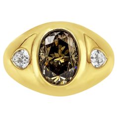 A unique gypsy fashion ring, featuring a 3.01 carats oval cut diamond certified by GIA as Fancy Dark Yellowish Brown color, set on a domed setting. Accented by two brilliant flush-set pear shape diamonds weighing 0.50 carat total. Finely made with 18K yellow gold. Size 7 US, resizable upon request.  Roman Malakov is a custom house, specializing in creating anything you can imagine. If you would like to receive a special quote on a custom piece, please message or call us. Brown Diamond Ring, Oval Cut Engagement Ring, Diamond Engagement Wedding Ring, Custom House, Three Stone Diamond, Vintage Diamond Rings, Stylish Rings, Diamond Cocktail Rings, Brown Diamond