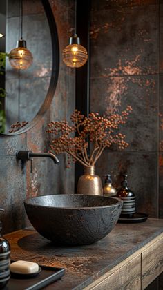 a bowl sink sitting on top of a wooden counter next to a vase with flowers