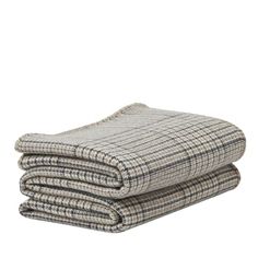 two blankets folded on top of each other in grey and white plaid pattern, with one blanket