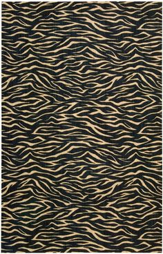 an animal print rug with black and white stripes on it's edges, in the shape of wavy lines