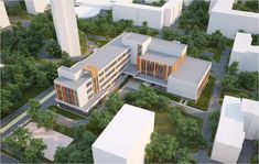 an aerial view of a building surrounded by trees