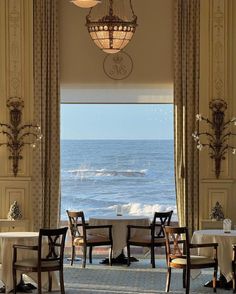 an elegant dining room overlooking the ocean