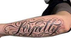 a man with a tattoo on his arm that reads, lonlly and has the word lonlly written in cursive font