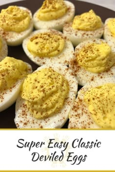 deviled eggs on a plate with mustard and seasoning