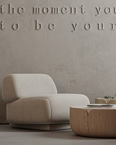 a white couch sitting next to a wooden table