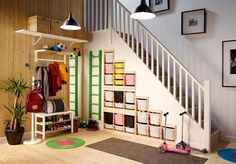 a child's playroom with toys and storage