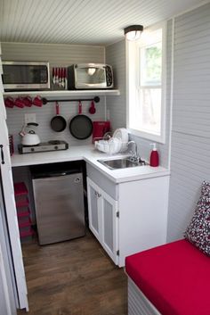 the small kitchen is clean and ready to be used as a place for cooking food