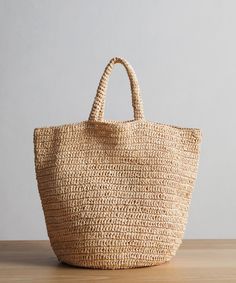 Woven Raffia Tote Natural OS Perfect for anything from summer getaways to farmers market runs, this packable tote bag is the ultimate accessory to always have on hand. Crochet raffia tote bag. Made in China. Wide-looped handles make it the perfect piece for days on the go. | Jenni Kayne Woven Raffia Tote Cheap Everyday Handwoven Straw Bag, Luxury Straw Tote Bag With Removable Pouch, Cheap Versatile Straw Tote Bag, Luxury Everyday Straw Bag With Removable Pouch, Luxury Tan Straw Bag Chic Style, Luxury Square Straw Bag For Everyday, Luxury Casual Rectangular Straw Bag, Affordable Everyday Bucket Straw Bag, Modern Luxury Straw Bag For Errands