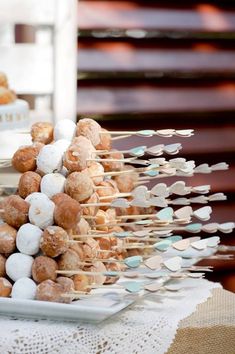 there are many donuts that are on the table and one is made out of marshmallows