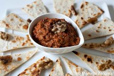 a plate with tortilla chips and salsa