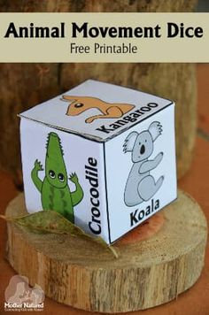 an animal movement dice sitting on top of a tree stump