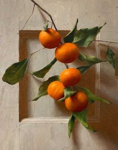 a painting of oranges on a branch with leaves