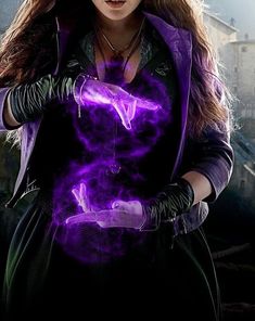 a woman with long hair wearing purple gloves and holding her hands out to the side