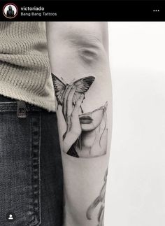 a woman's arm with a tattoo on it