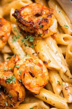 pasta with shrimp and parsley in a white bowl